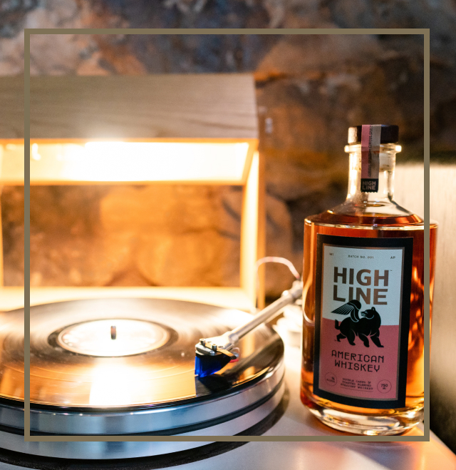 Image of Highline American Whiskey sitting on the side of a record player